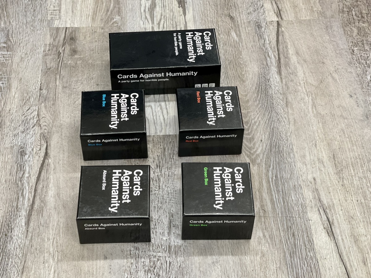 Cards Against Humanity w/ 4 Expansion Packs Brand New | Buya