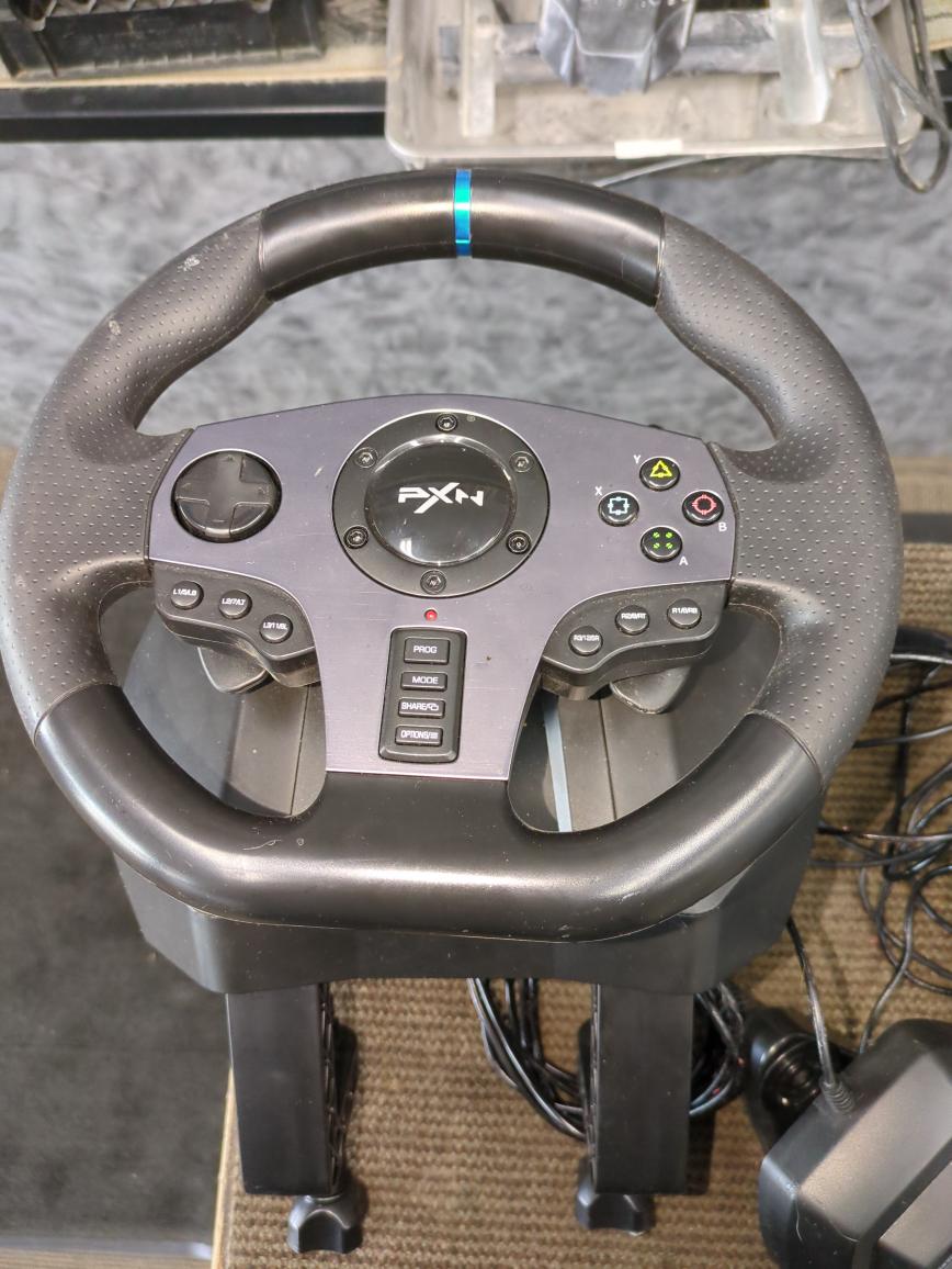 PXN V9 GAMING RACING WHEEL AND PEDDELS.AS IS STICKY RESIDUE ON CORDS