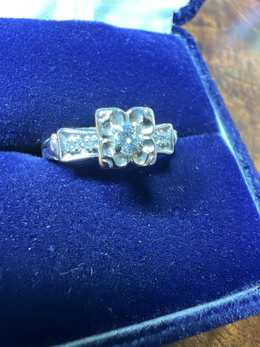 Lady's Diamond Solitaire Ring 5 Diamonds .14 Carat T.W. 14K Yello